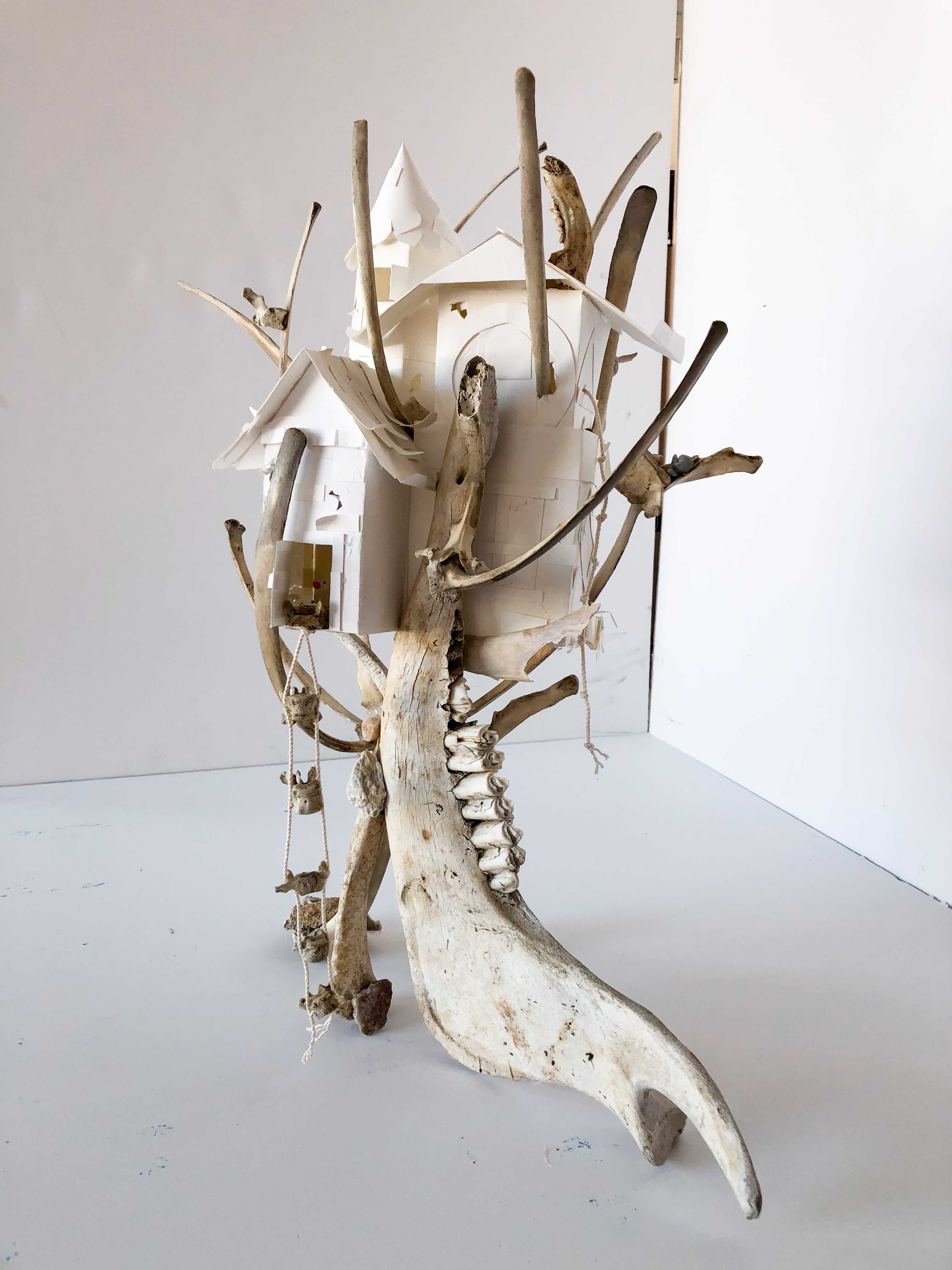"Sycamore Home" sculpture. A detailed home crafted into a sycamore branch